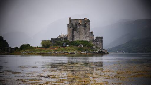 The most photographed Castle in Scotland.Eilean Donan castle appearing out of the mist.