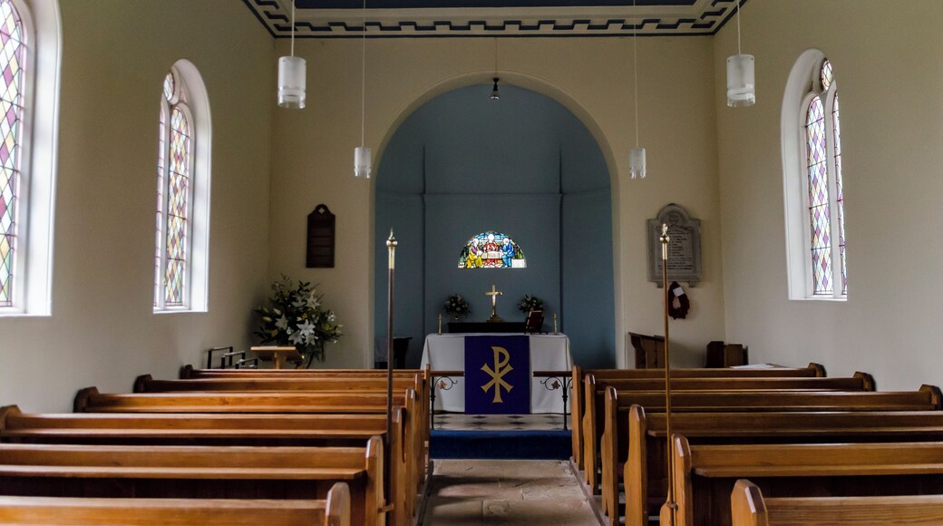 There has been a church in Morton (mentioned in the Domesday book) since mediaeval times, but this church was built in 1756, and is constructed of red brick with a slate roof. There is a western tower and nave with chancel in one, a small apse and north vestry. The embattled brick tower is of four stages. There are two bells. The west porch, in the base of the tower leads into the nave. The inside is plain. There is a small semicircular window in the east wall of the apse with glass by Heaton Butler and Bayne. There is a small pipe organ by Hadfield, which was installed in 1967 and replaced a larger organ. Pevsner describes the interior as "devoid of appeal".