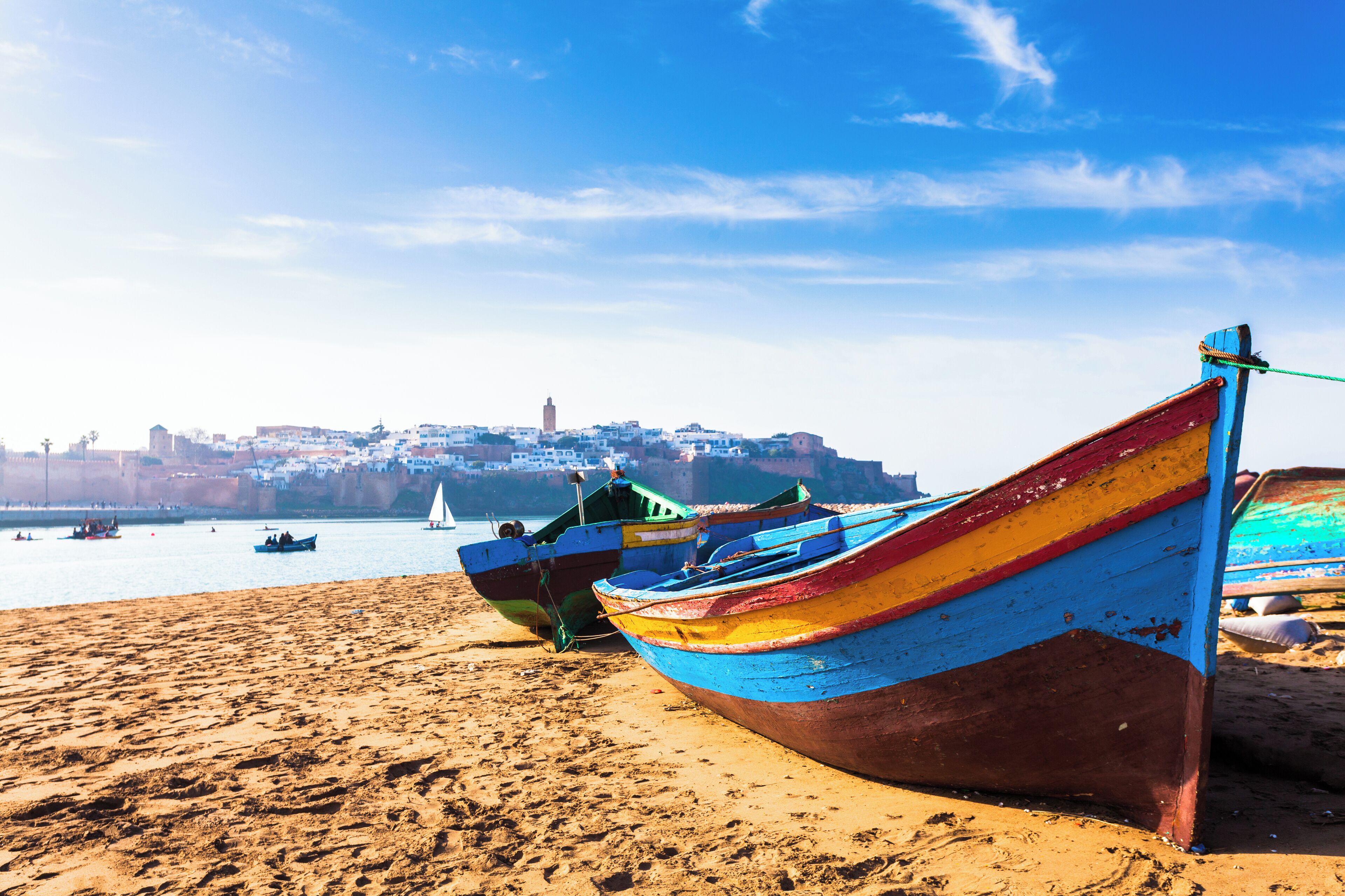 Boats along the beach and the medina in the background