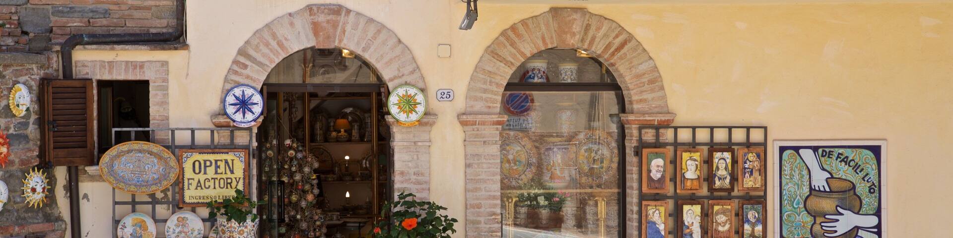 A storefront with ceramic vases and pottery.