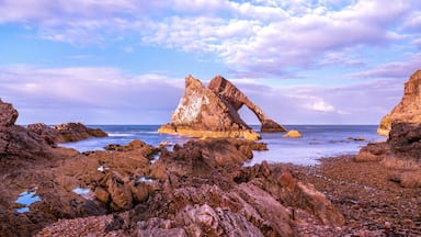 Bow Fiddle Rock during sunset - A natural sea arch near Portknockie on the north-eastern coast of Scotland
