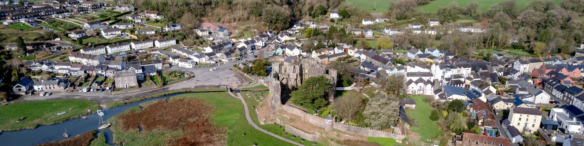 Drone view of Laugharne Castle and surrounding landscape