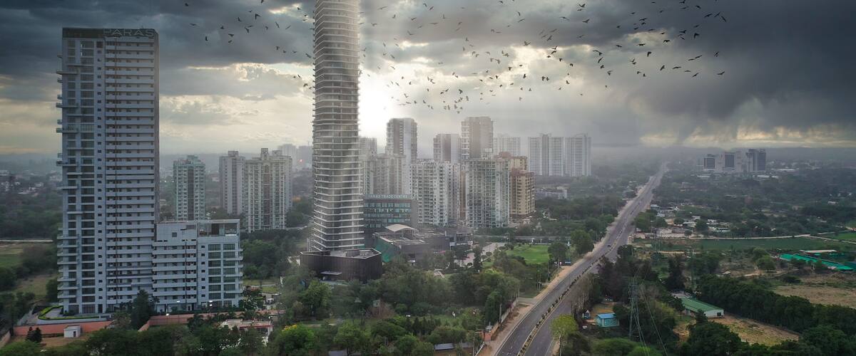 A cityscape with a prominent tower labeled 'Paras Trade Centre' amidst other high-rise buildings, under a cloudy sky with birds flying.
