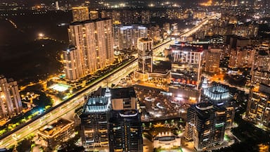 Aerial view of Gurugram downtown at night, view of illuminated building in Haryana district, India.