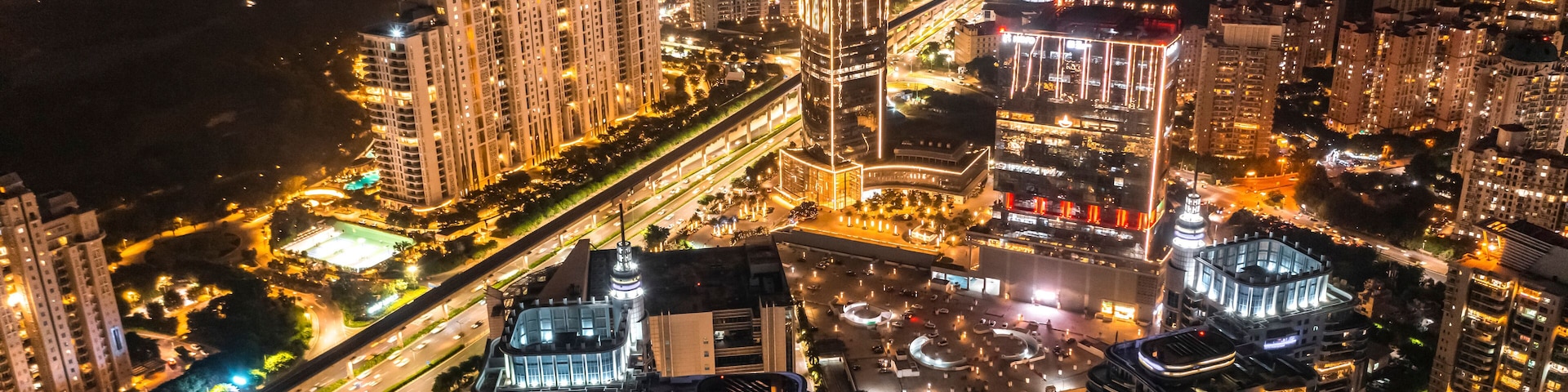 Aerial view of Gurugram downtown at night, view of illuminated building in Haryana district, India.