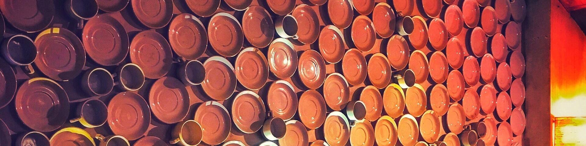 A wall of stacked plates and bowls.