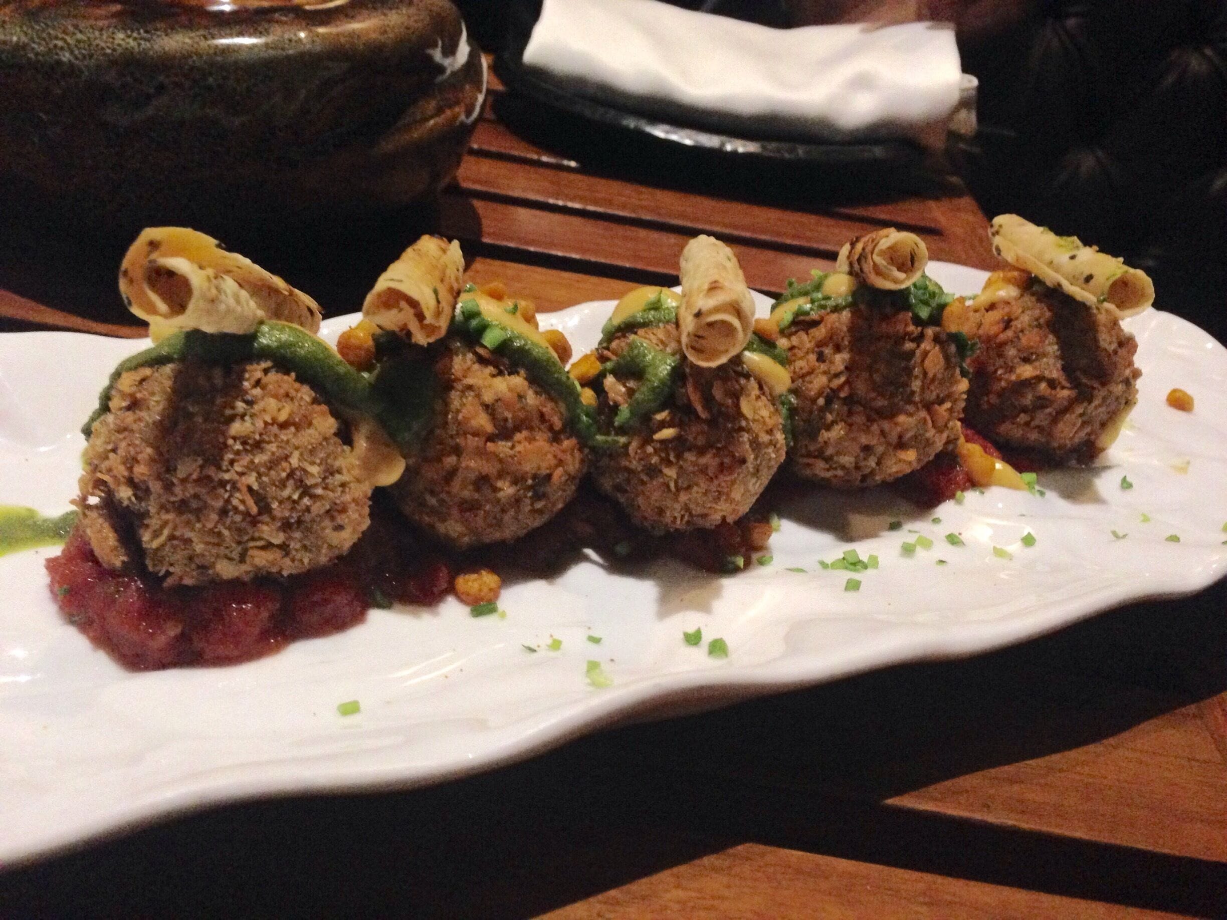 #delicious
Dal Chawal Arancini served with rolled-up papad on a bed of onion chutney in an entirely Sicilian presentation but a flavour that is the pure north Indian comfort food of lentil, rice and pickle.