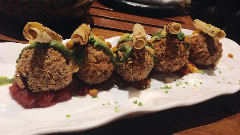 #delicious
Dal Chawal Arancini served with rolled-up papad on a bed of onion chutney in an entirely Sicilian presentation but a flavour that is the pure north Indian comfort food of lentil, rice and pickle.