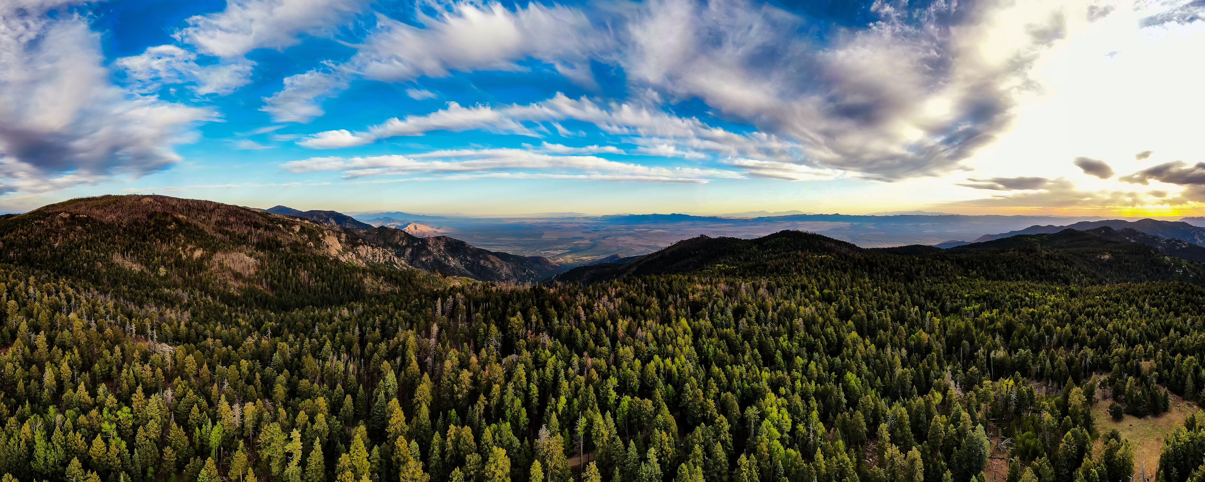Aerial panoramic image of the sunset from the very top of Mt. Graham in southeastern Arizona. 