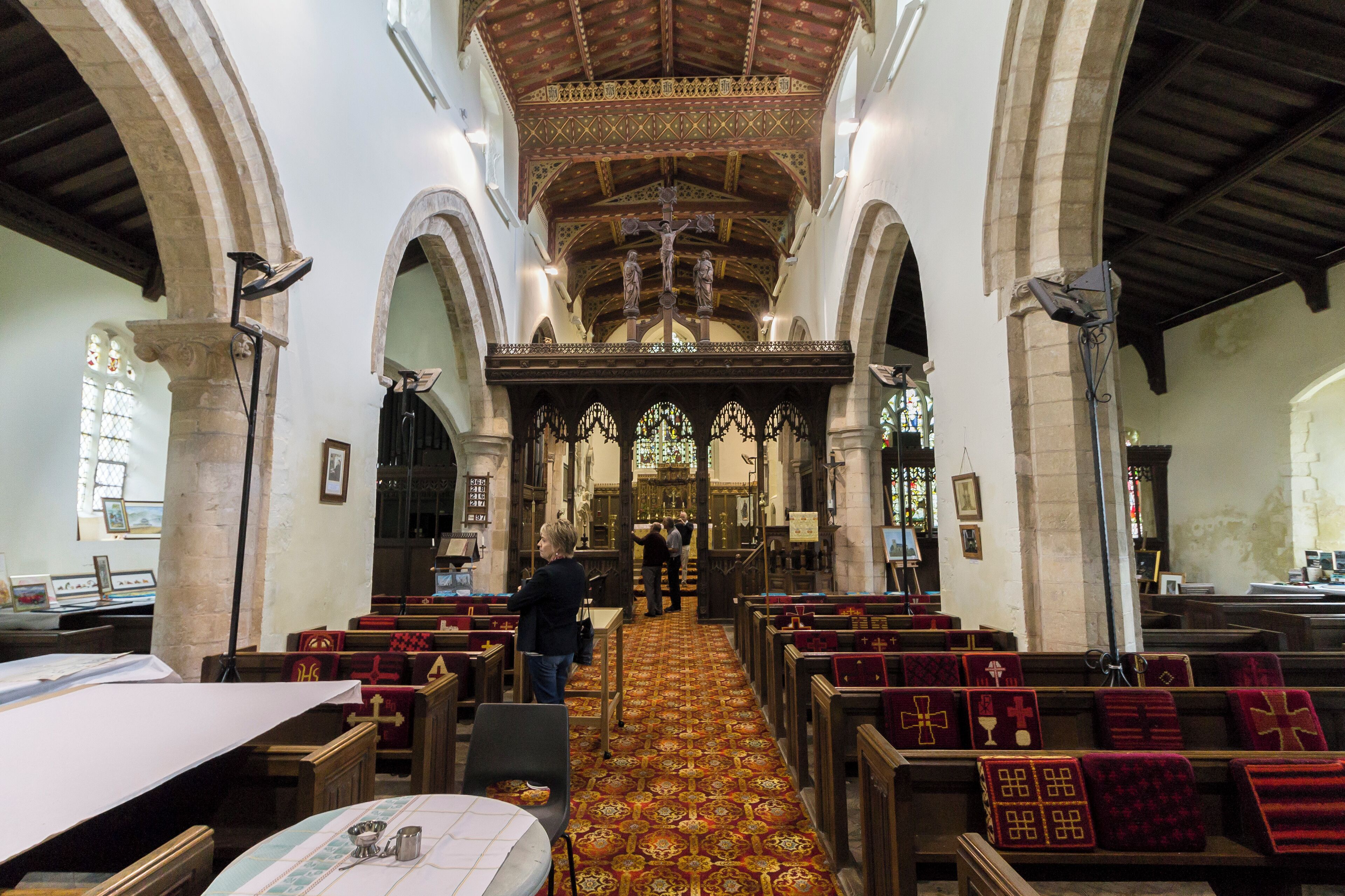 St Laurence's church, Corringham, dates from the 11th C.onwards with 1882 restoration by Bodley and Garner. The lych gate was built in the 1880's and the South porch was rebuilt by Bodley. The tower was built in the 10th C. to a pre-existing wooden church (burnt down by the Danes) and is built in Jurassic limestone quarried from the Lincoln Edge. The tower arch with seven roll mouldings stands on a plinth of four chamfered set-offs and is 17 ft 6" high. The south and west faces of the tower contain stones showing charred red brown colour, evidence of the torching by the Danes. In 1849 the nave roof was altered from being a pitched roof to a "flat" roof, and the Anglo-Saxon doorway above the tower arch served no purpose so it was blocked up. The font is situated under the tower arch and was made by George Green of Gainsborough in the 1849 restoration. The north aisle dates from 11C and was enlarged in 14C. The Lady Chapel dates from 13C and is dedicated to the Blessed Virgin Mary. The ceiling, by G.F. Bodley (1884), contains the "M" motif - representing the Magnificat. The Chancel has a rood screen made of oak, the base is the original rood screen which was taken down in 1565 and sold to Thomas Broxholme for 16 shillings. It was later discovered at the Vicarage and re-erected by Bodley in 1884. The choir contains choir stalls with misericords. There is an Easter Sepulchre between the north door and the east wall and this has been re-used for the recessed tomb of William de Gare 1277-1290, Archdeacon of Lincoln. The Organ was installed in 1884 by Messrs. Wordsworth and Maskell of Leeds and paid for by public subscription. It has a tracker action. In the 1950's it was electified and in 1974 it was cleaned and restored by Cousans of Lincoln when a balance swell pedal and two extra stops were added. The organ case was decorated by Bodley with Latin verses from the Psalms. The Lancet window in the West tower wall is a 13th C. window with the stained glass being inserted in 1878 by C. Kempe (1838-1907) showing John the Baptist, the prophet Isaiah, and King David. The two north aisle windows are Perpendicular (14C) and have clear quarries with emblems, in colour, representing the Passion of Christ - nails, rope, dice, lance with sponge on reed and the scourges. Pic by Jenny.