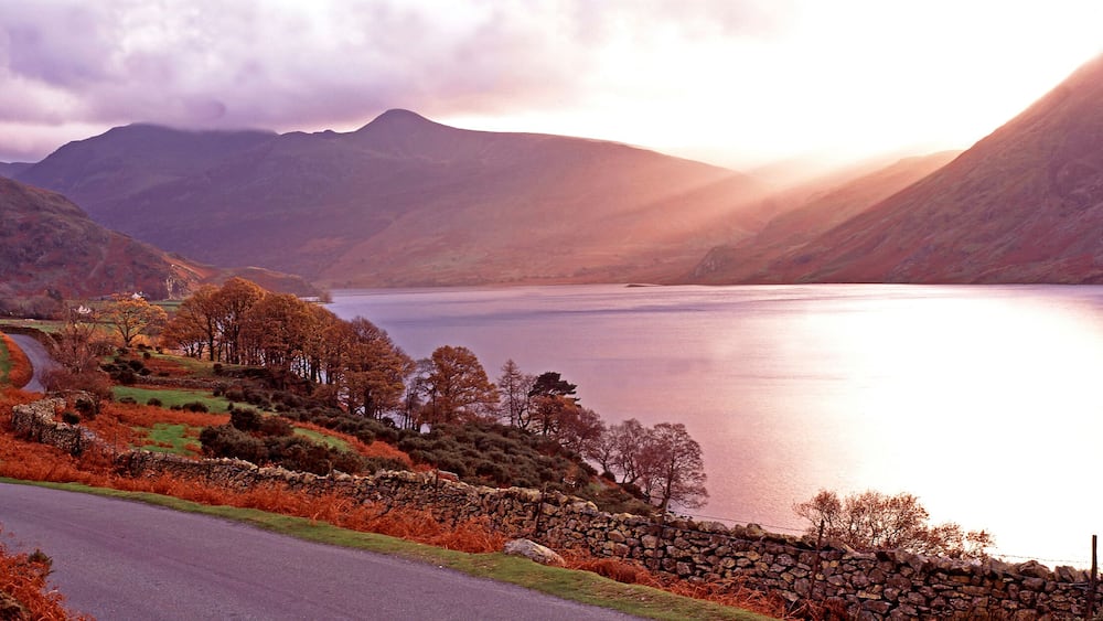 Warm panoramic autumn sunset over Buttermere in the Lake District Cumbria
