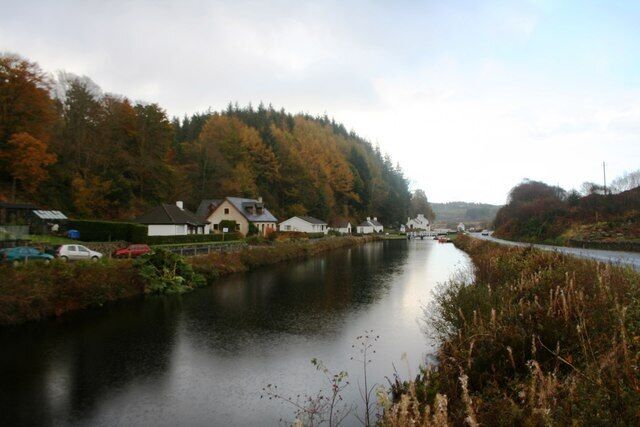 Crinan Canal at Cairnbaan Between the canal locks at Cairnbaan with a row of cottages on the left leading the way to the hotel.