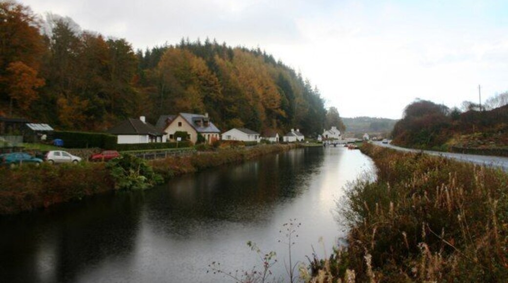 Crinan Canal at Cairnbaan Between the canal locks at Cairnbaan with a row of cottages on the left leading the way to the hotel.