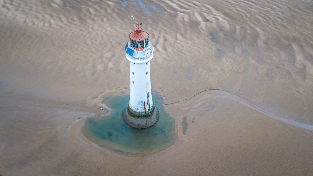 Overloonh the beach at Wallasey with New Brighton Lightouse in the foreground