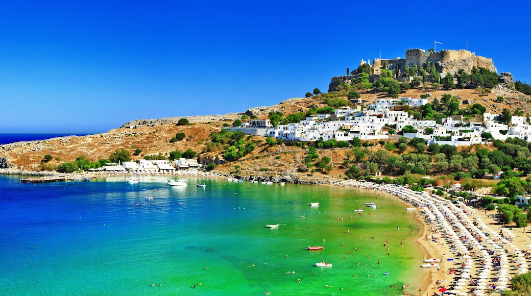 8K Wide Panorama of Lindos Bay and Acropolis Rhodes Island Greece Aerial View of White Village and Mediterranean Sea Coast High Resolution