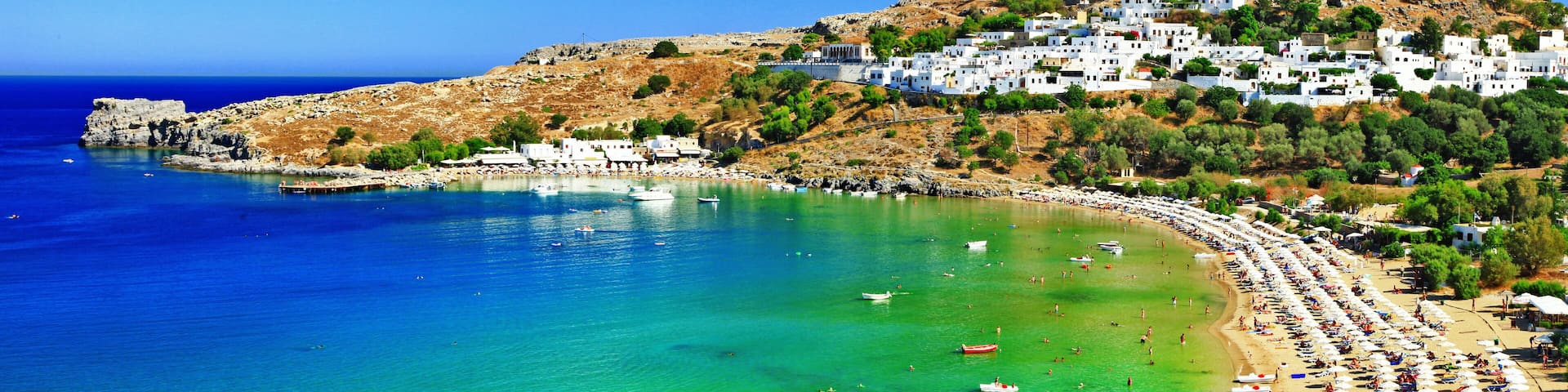 8K Wide Panorama of Lindos Bay and Acropolis Rhodes Island Greece Aerial View of White Village and Mediterranean Sea Coast High Resolution