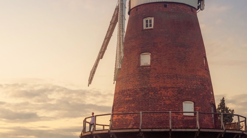 Lovely walk on local public pathway with fantastic views of Windmill known variously as John Webb's Mill or Lowe's Mill.
Thaxted Windmill is a grade II listed tower mill on the edge of the historic hilltop town of Thaxted, about 6 miles south east of Saffron Walden. The mill stands 48 feet high, and is made of red brick, with four wooden sails.
The mill was erected in 1804 on land owned by John Webb, a successful businessman who owned a number of properties locally, including a brick and tile work, and the local Swan Inn. There were 4 other mills in Thaxted at the time, but these were traditional post mills, whereas Webb's Mill was built to a tower design (a post mill rotates the entire body of the structure around a central column, while a tower mill rotates a moveable cap to which the sails are attatched).
The family of millers who worked the mill were the Lowe family, and so the building is sometimes referred to as Lowe's Mill. Interestingly, one of the recent leaders of the John Webb’s Windmill Trust that runs the mill is a direct descendent of the Lowe family.
The building material was local brick, fired just half a mile away, and there were 3 sets of millstones. The mill was in operation for just over a century, but by 1907 it was uneconomic to keep open. The advent of efficient steam engines made wind power less appealling and more costly.
#red #windmill #sunset #uk #britain #england