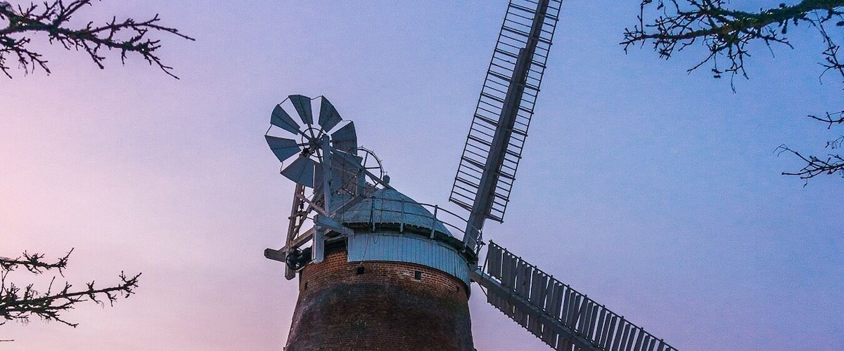 Lovely walk on local public pathway with fantastic views of Windmill known variously as John Webb's Mill or Lowe's Mill.
Thaxted Windmill is a grade II listed tower mill on the edge of the historic hilltop town of Thaxted, about 6 miles south east of Saffron Walden. The mill stands 48 feet high, and is made of red brick, with four wooden sails.
The mill was erected in 1804 on land owned by John Webb, a successful businessman who owned a number of properties locally, including a brick and tile work, and the local Swan Inn. There were 4 other mills in Thaxted at the time, but these were traditional post mills, whereas Webb's Mill was built to a tower design (a post mill rotates the entire body of the structure around a central column, while a tower mill rotates a moveable cap to which the sails are attatched).
The family of millers who worked the mill were the Lowe family, and so the building is sometimes referred to as Lowe's Mill. Interestingly, one of the recent leaders of the John Webb’s Windmill Trust that runs the mill is a direct descendent of the Lowe family.
The building material was local brick, fired just half a mile away, and there were 3 sets of millstones. The mill was in operation for just over a century, but by 1907 it was uneconomic to keep open. The advent of efficient steam engines made wind power less appealling and more costly.
#red #windmill #sunset #uk #britain #england #eastanglia #colours #history #perspectives