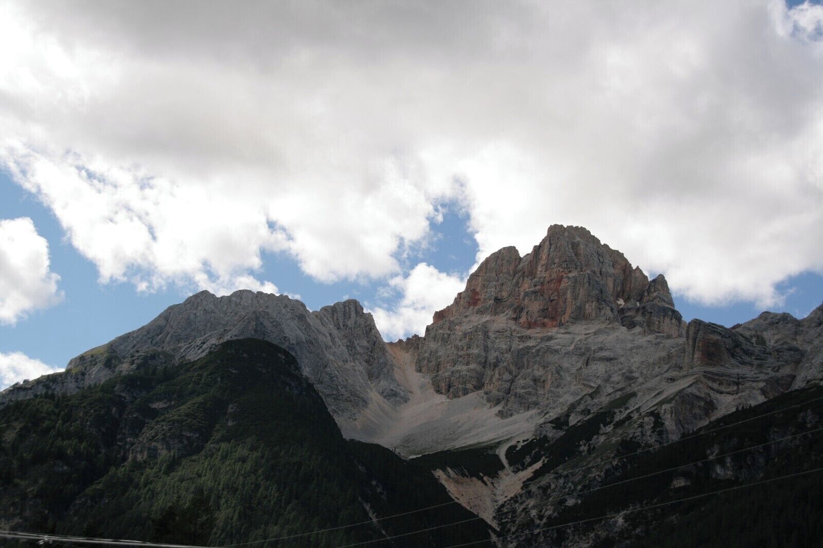 A mountain range with a prominent peak and surrounding valleys.