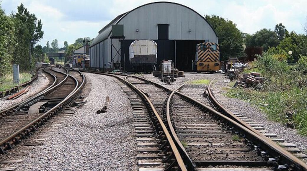The former Swindon shed at Williton Station on the West Somerset Railway, a steam operated heritage railway in the English county of Somerset. The station platforms can be seen in the left distance. The shed is used by the West Somerset Railway Association for the restoration of locomotives and carriages. Photograph taken with permission using a Lineside Photographic Pass available from the railway at its Minehead station. For more information see the Wikipedia article Williton railway station.