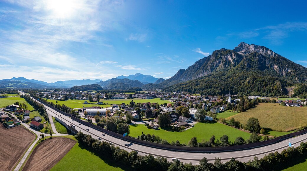 Austria, Salzburger Land, Grodig, Drone panorama of highway stretching past rural town in summer