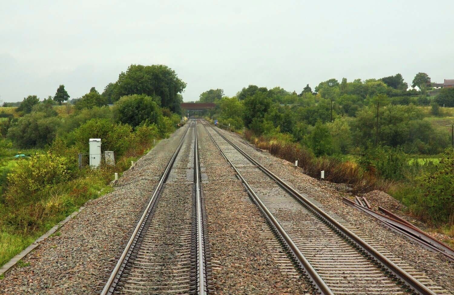 The railway embankment nears the River Avon