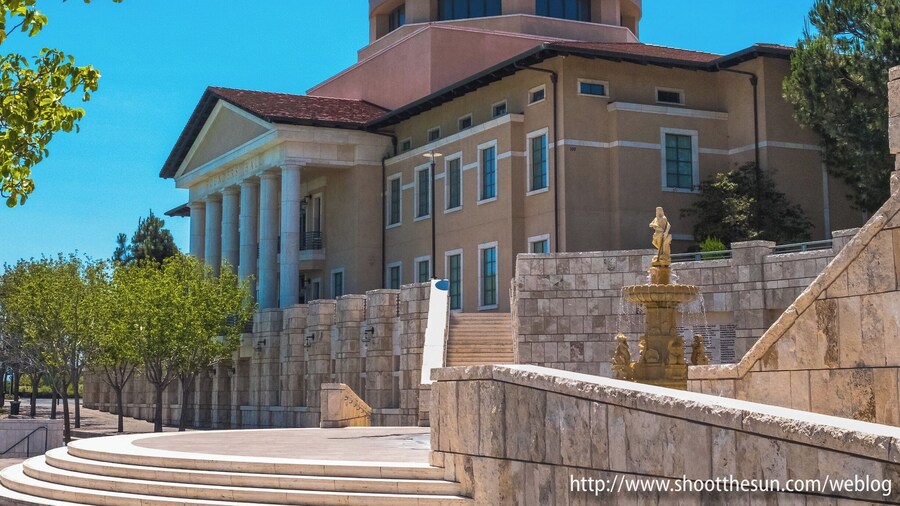 Soka University is probably the best-kept secret in all of Orange County, and probably all of California itself. You mention it to the locals and they just give you blank stares.
But it is the kind of place that will stick in your memory for the rest of your life. The grounds of the campus are situated at the ridge between Aliso and Wood Canyons, and command a view of the area that can only be described as staggeringly beautiful.
To say those canyons have competition from the scenery inside the grounds is to make the understatement of this young century.
Established just fifteen short years ago, the university seems to have spared no expense to build a campus worthy of its purpose. Here, you will find a delicate balance of architectural styles - heavily influenced by the very early European Renaissance, but containing elements of post-modernism, classical Greek, medieval Italian and even a hint of Empiric Spain.
But it isn't just a pretty face. The school has been consistently voted best in its treatment of its freshman class. It requires one semester study abroad, and has partnered with universities all over the world to make that a reality.
I'm afraid I didn't do too much looking into the academic side of the house. I was really too overwhelmed by its beauty.
And its calm. Come here on a weekend day and you'll spend most of the time in solitude. This was a welcome change from the parking lot called Highway 1, which took up the bulk of my late afternoon a day earlier.
I could breathe in this place, move from one astounding sight to another and just feel the calm descend over me.
That no-one in Southern California seems to know it exists is almost a comfort, really. It might mean that my second visit, whenever that may happen, will be as blissfully free of the tourist trappings as the first.
Either way, though, I just can't wait to go back.
I've posted a large gallery of shots on my blog, some of which will appear here on Trover. If you're looking for the full set, just follow this link: http://www.shootthesun.com/weblog/?p=2223