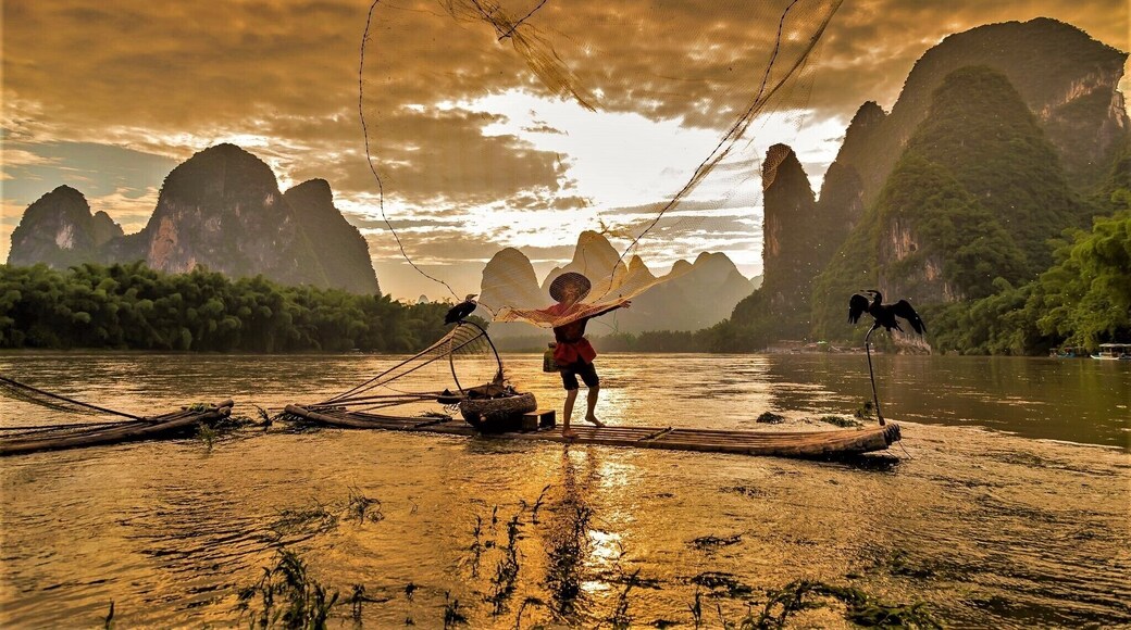 No 1 on my bucket list for 30yrs. After 3 days of torrentil rain the river is actually flooded, not even the tour boats could go out, and the surrounding farms flooded. photo is taken from a small island in the middle of the river but it too was under water and I was knee deep taking the photo. These fisherman now only survive on the money from photographers, a dying breed
