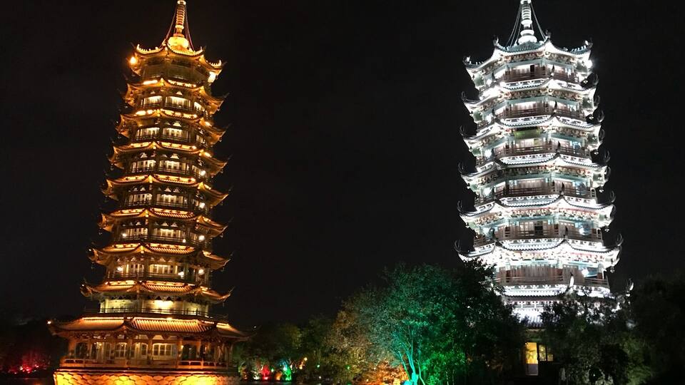 Located in Guilin, Two Rivers and Four Lakes Scenic Spot refer to the landscape - Sun and Moon Pagodas - Mulong Pagoda was built by imitating Longhua Pagoda in Song Dynasty in Shanghai.