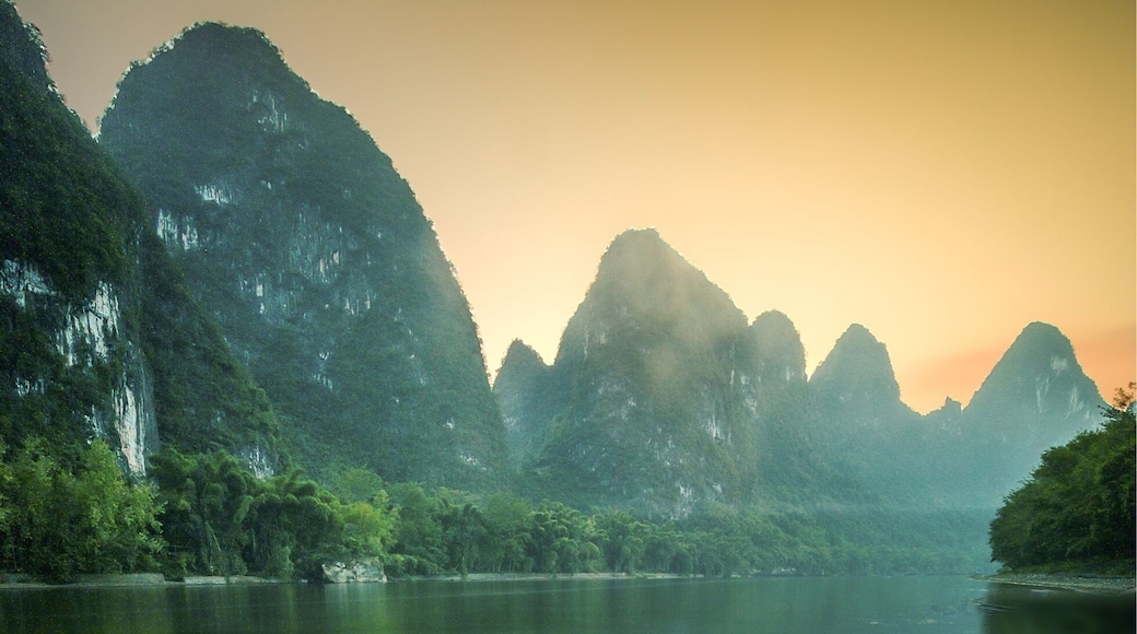 A view of the sunset at XingPing near Yangshuo. The mountains here are spectacular and are a must see, follow the river out of the town and head towards the first big bend. Wait until sunset and the boats stop creating waves, if not then stick on a ten stop filter and ignore them. 😊, or you can be like me and do both.