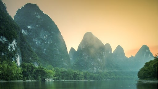 A view of the sunset at XingPing near Yangshuo. The mountains here are spectacular and are a must see, follow the river out of the town and head towards the first big bend. Wait until sunset and the boats stop creating waves, if not then stick on a ten stop filter and ignore them. 😊, or you can be like me and do both.