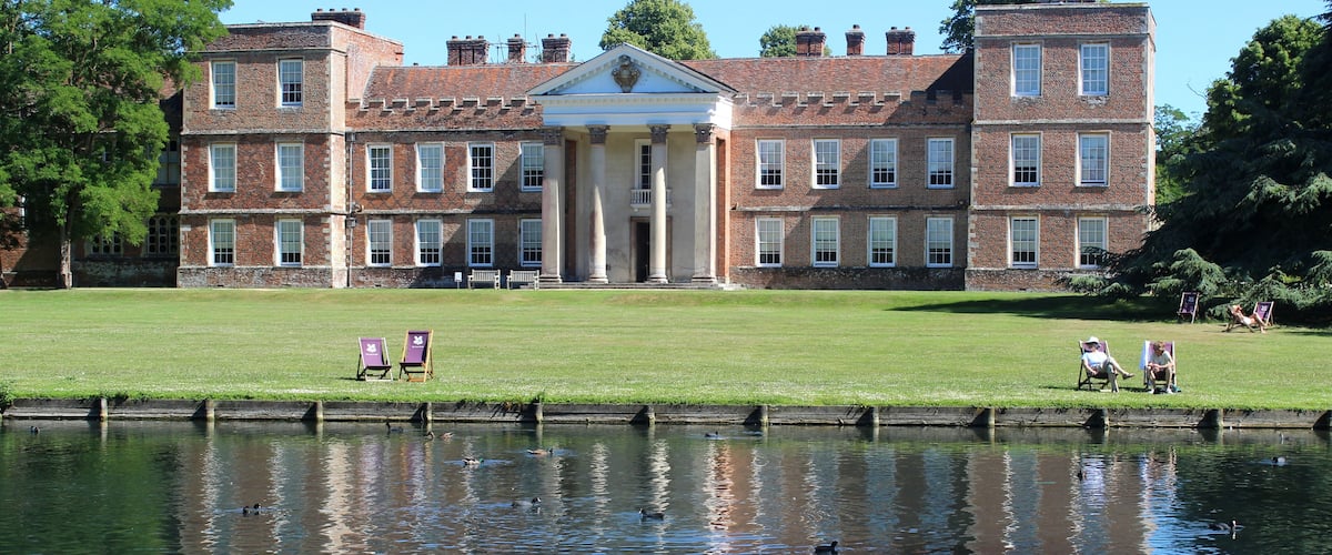 View of The Vyne, a sixteenth century Grade II listed building owned by National Trust, taken from across the lake.