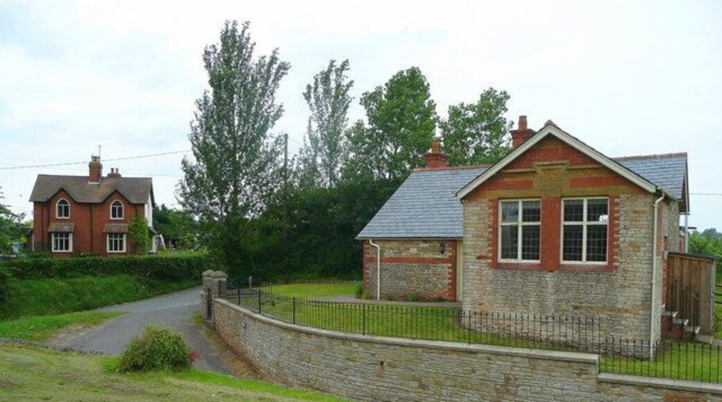 Two Victorian Buildings? The cottages to the left certainly are; the building on the right, which is currently the village hall, used to be a school and has inscribed the date in Roman numerals MCMV, 1905, as well as Vicar's School Founded 1842. So the gable end facing the camera could have been an later extension.