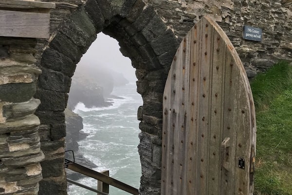 Old door of Tintagel Castle leading to some very steep steps. A little easier on the way down.