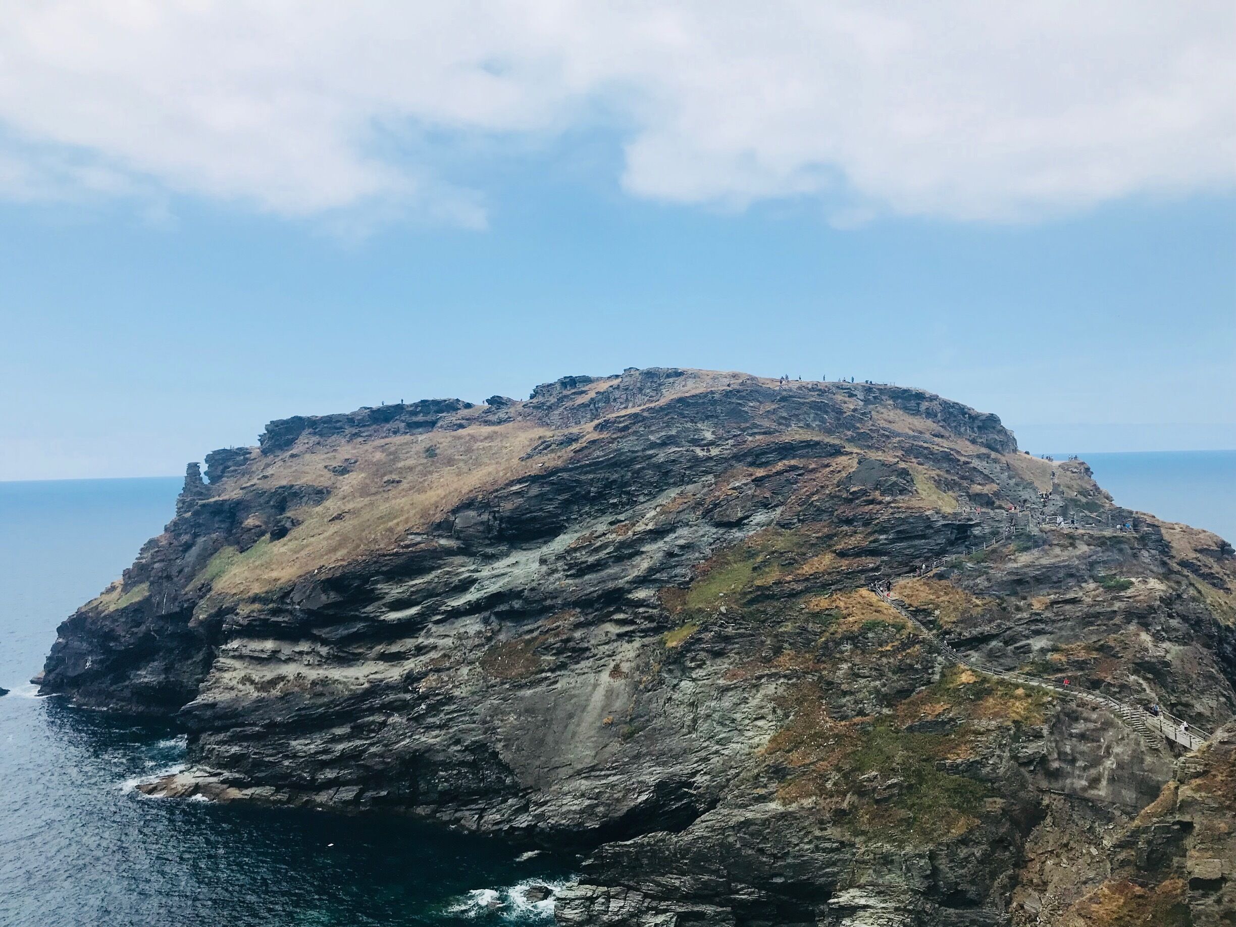 Tintagel Castle is a medieval fortification located in North Cornwall. Visitors like myself flock to see Tintagel Castle as it has a long association with legends related to King Arthur. The long walk down & up the castle cliffs is worth the amazing views. In the height of summer it’s packed with people so be prepared for queues and bring a bottle of water as you break a sweat during the trek up and down Tintagel.