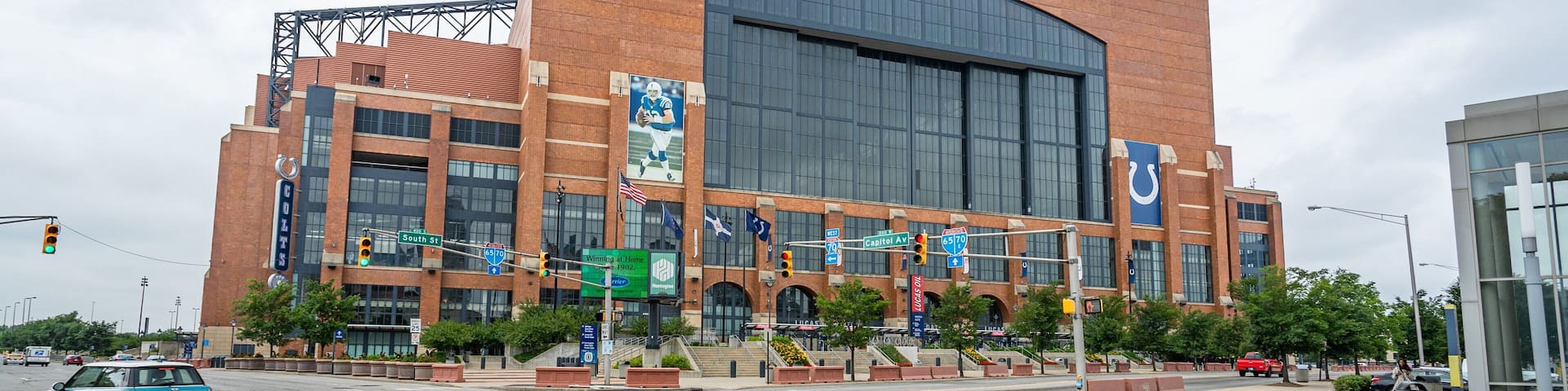 Lucas Oil Stadium with a large brick facade and a prominent sign.