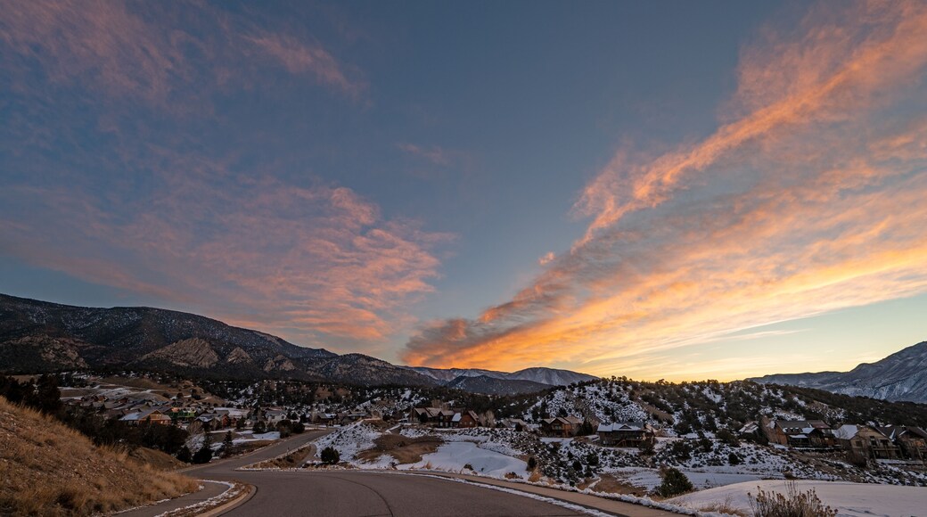 Colorful orange and blue winter sunrise cloudscape over New Castle in western Colorado.