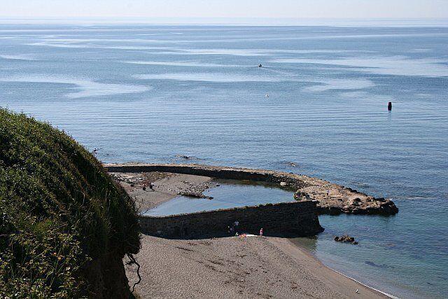 Portwrinkle Harbour. The Banjo Pier built when this village was founded as a pilchard fishery is still in place. This photograph was taken from the coast path just to the west of the village.