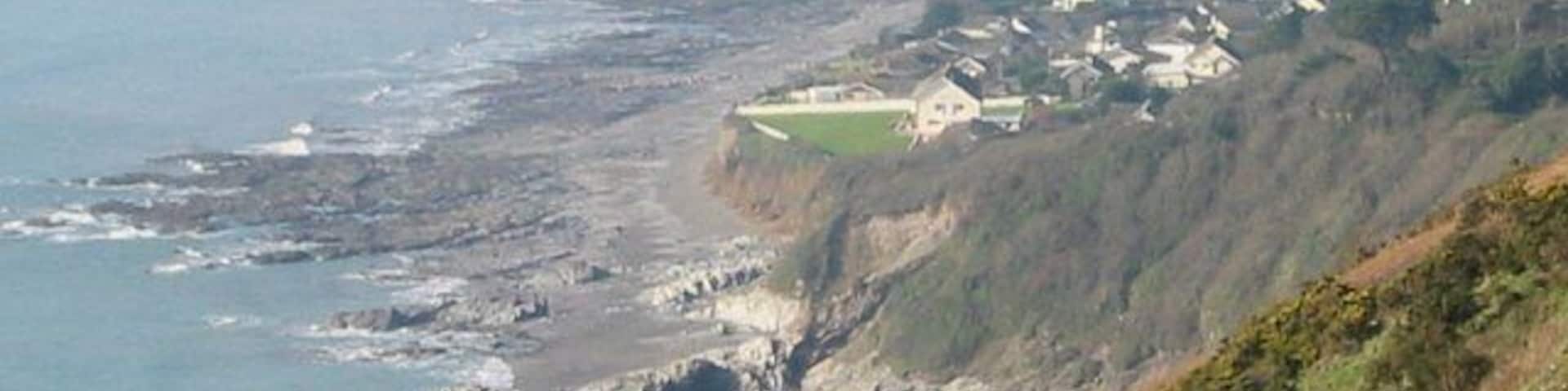 Downderry - east side, from Battern Cliffs. A zoomed shot from an adjacent grid square gives a view of Downderry which emphasises its location on a precarious platform of soft rock above the sea.