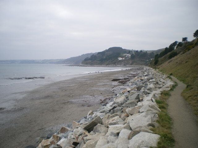Sea defences and the coast path at Seaton Much of the cliff-bottom at Seaton beach is protected from erosion by these rock defences.