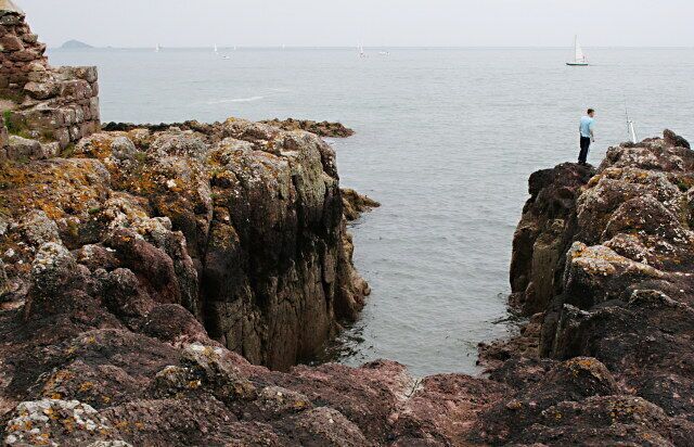 Near Cavehole Point This cutting into the felsite rock which forms the foreshore stands next to a ruined pilchard cellar and was presumably created so that boats could land their catch next to the cellar. Nowadays it is a useful location for sea anglers.
