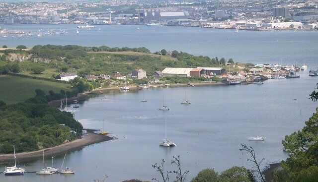 Southdown on the Insworke Peninsula. This photograph was taken from the viewpoint on Maker Heights at SX430515. It looks very pretty with the tide in but when the tide is out - which is most of the time - almost all the foreground water is mud flats. In the background is the River Tamar and Devonport Dockyard.