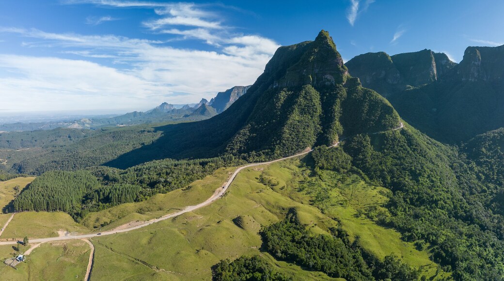 Panorama of the mountains in Brazil. Mountain range in the state of Santa Catarina, place named Serra do Corvo Branco with curved road leading up through the mountain pass