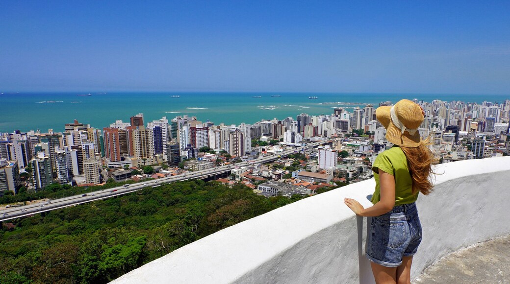 Traveling in Brazil. Panoramic view of female tourist with hat in Vila Velha city, Greater Vitoria, Espirito Santo, Brazil.