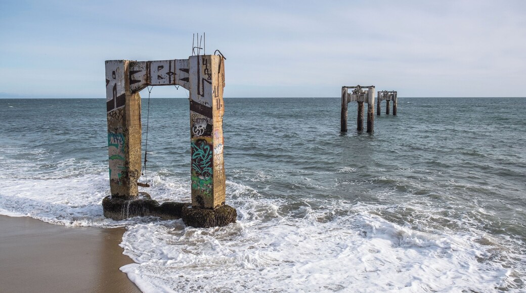 This unique spot is the site of old concrete pier ruins in the quaint coastal village of Davenport, which now is just a set of concrete pylons that used to hold it up. Davenport is located just North of Santa Cruz, on the northern edge of the famed Monterey Bay Peninsula. The pier is a spot known to attract photographers from all over wishing to capture the beautiful abandoned pier.
The only way down to the beach is down a steep cliff. At the top of the climb down this is a climbing rope jimmy rigged to a metal fence pole which helped with getting up and down. The trail down the cliff needed a little bit of climbing experience but it wasn't as daunting as it seems from above.
#likealocal