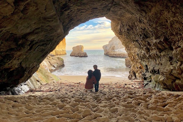 Sitting under a sea cave with my little one at Shark Fin Cove. A picturesque beach with stunning views of Northern California's stunning coastal landscape. During low tide, you can explore all kinds of sea creatures in the tide pools and if you're lucky, you can spot humpback whales during their migration season. There is a small parking lot by a discontinued railroad track where you can park your car and walk across to the beach entrance. It can be a bit steep and slippery at times so wear good shoes! #Adventure #beautifulplaces #familytime #memories #discoveries #exploring #withchildren #nature #outdoors #lanscape #northerncalifornia #beaches #usa #sharkfincove #davenport #santacruz