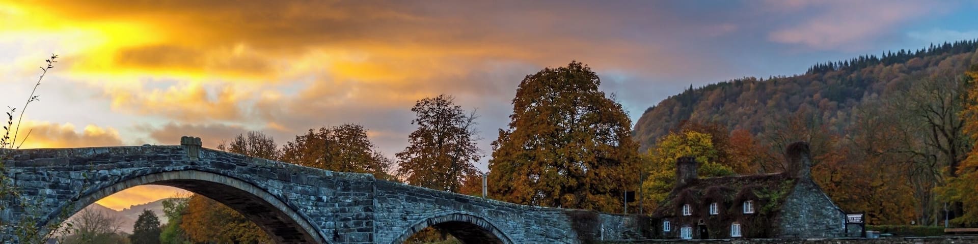 We stayed in Llanwrst for a few nights and on our last morning just after we loaded up the car the sky was being lit up by the rising sun - our first encounter of the bridge was meeting another car midway and it having to back down as it is only wide enough for one vehicle - I think this bridge causes a few problems at busy times. There is also a delightful tearoom which is situated in the adorable cottage you can see called Sunrise colour over Tu Hwnt Ir Bont and they do just the best scones! This is a delightful place to stay for a break in beautiful Snowdonia just a few miles away from Betws-y-Coed. #Instone #snowdonia