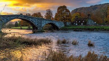 We stayed in Llanwrst for a few nights and on our last morning just after we loaded up the car the sky was being lit up by the rising sun - our first encounter of the bridge was meeting another car midway and it having to back down as it is only wide enough for one vehicle - I think this bridge causes a few problems at busy times. There is also a delightful tearoom which is situated in the adorable cottage you can see called Sunrise colour over Tu Hwnt Ir Bont and they do just the best scones! This is a delightful place to stay for a break in beautiful Snowdonia just a few miles away from Betws-y-Coed. #Instone #snowdonia