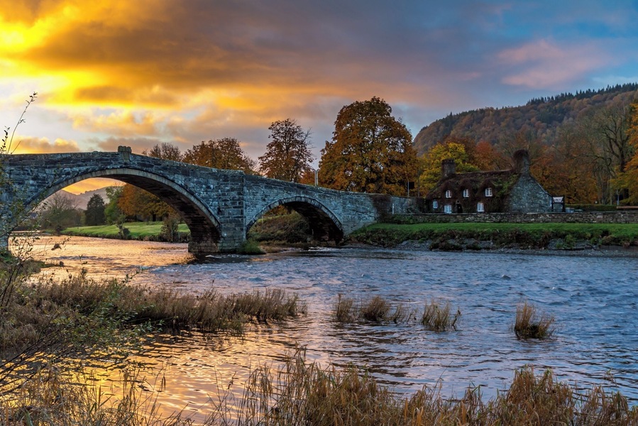 We stayed in Llanwrst for a few nights and on our last morning just after we loaded up the car the sky was being lit up by the rising sun - our first encounter of the bridge was meeting another car midway and it having to back down as it is only wide enough for one vehicle - I think this bridge causes a few problems at busy times.  There is also a delightful tearoom which is situated in the adorable cottage you can see called Sunrise colour over Tu Hwnt Ir Bont and they do just the best scones!  This is a delightful place to stay for a break in beautiful Snowdonia just a few miles away from Betws-y-Coed.  #Instone #snowdonia