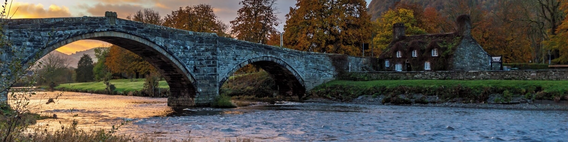We stayed in Llanwrst for a few nights and on our last morning just after we loaded up the car the sky was being lit up by the rising sun - our first encounter of the bridge was meeting another car midway and it having to back down as it is only wide enough for one vehicle - I think this bridge causes a few problems at busy times. There is also a delightful tearoom which is situated in the adorable cottage you can see called Sunrise colour over Tu Hwnt Ir Bont and they do just the best scones! This is a delightful place to stay for a break in beautiful Snowdonia just a few miles away from Betws-y-Coed. #Instone #snowdonia